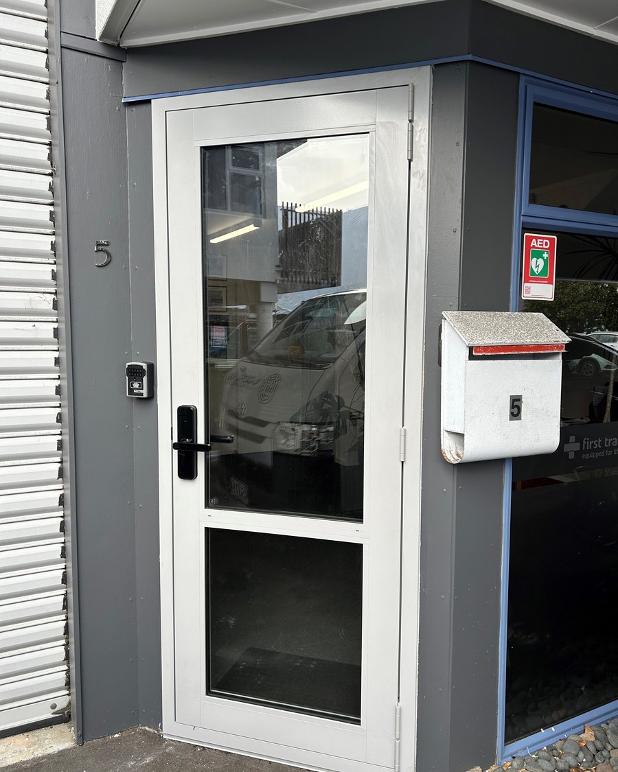 Commercial frontage with smart locks fitted to the glazed entry doors